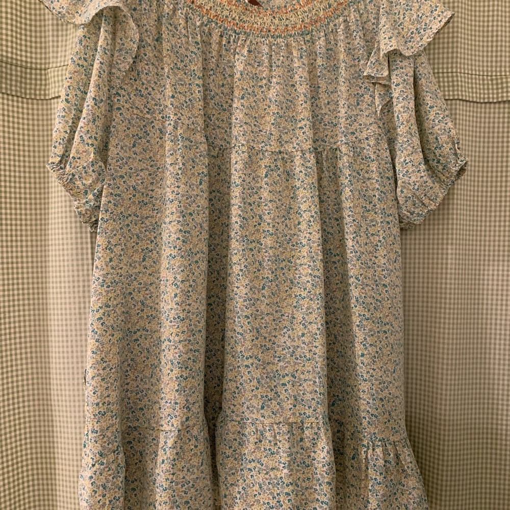 Green floral flutter puff-sleeve dress with pockets by Davi & Dani.